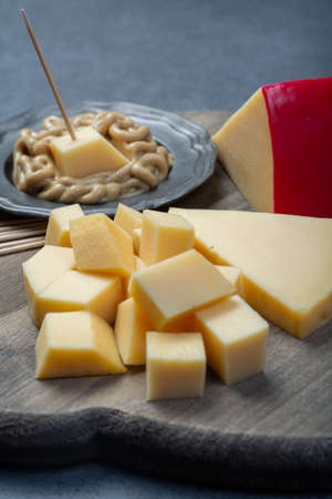 Snack food, blocks of Dutch red ball Edam cheese and mustardの写真素材