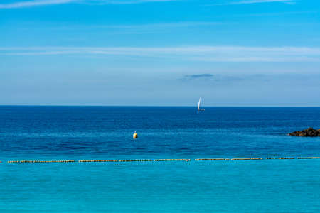 Winter sun travel destination, warm blue ocean swim water on Amadores beach, Gran Canaria, Canary islands, Spainの写真素材