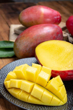 National fruit of India, Pakistan, and Philippines tropical organic ripe red mango ready to eat close upの写真素材