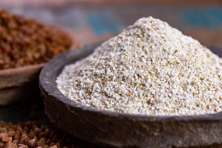 Healthy diet superfood buckwheat groats and flour used for making delicious pasta, noodles, pancaces and kasha in many countries close upの写真素材
