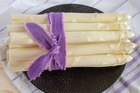 New harvest of white asparagus vegetable, high quality raw asparagus in spring season, ready to cook...