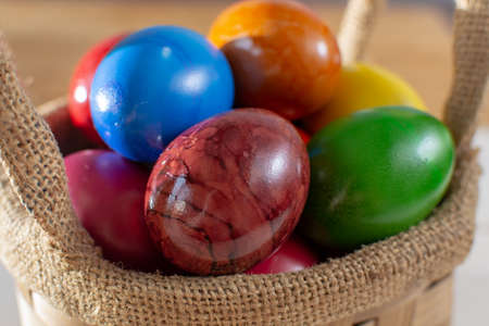 Cooked chicken eggs for Ester celebration dinner, colorful painted with organic paint ready to eat...