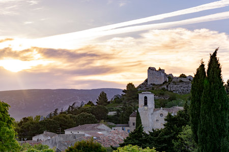 View on traditional medieval houses and castle ruines in Provence during sunrise, South of France, vacation and tourist destinationのeditorial素材