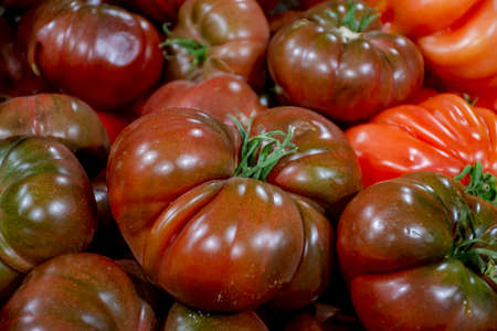 Big ripe french tomatoes, food background close upの写真素材