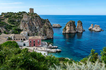 Scenic coastline with rocks and deep blue sea near Castellamare del Golfo by entrance to natural...