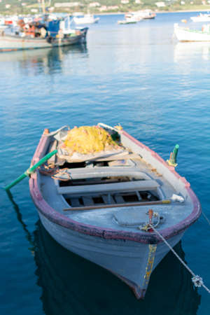 Seascape with quiet sea harbor and traditional greek fisher boatの写真素材