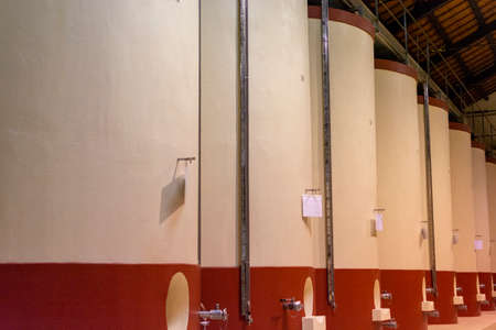 Modern wine production in Italy, concrete tanks for wine fermentation close upの写真素材