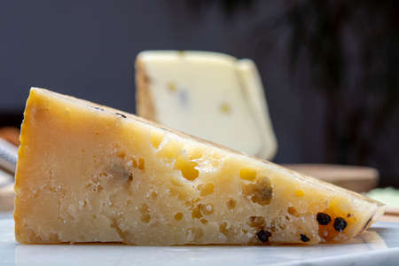 Cheese collection, Italian aged pecorino cheese with black peppers made in region Nebrodi, Sicily, Italy, close upの写真素材
