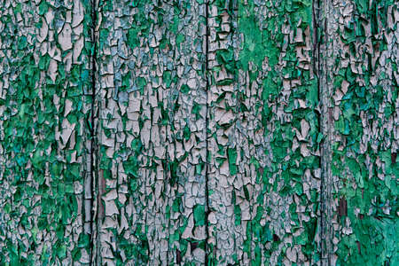 Background with old painted cracked green wooden wall planks copy spaceの写真素材