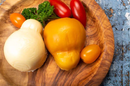 Cheese collection, white and smoked yellow italian scamorza cheeseの写真素材