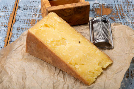 Cheese collection, aged yellow hard, Maniva cheese from Alpine valleys near Mount Maniva, North Italyの写真素材