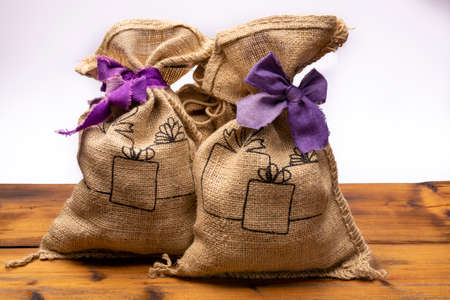 Celebration of Saint Nicholas, patron saint of children in Netherlands, Belgium, Luxembourg and North of France in first week of December, burlap sacks with presents and candy for kids  close upの写真素材