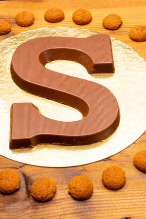 Celebration of Saint Nicholas, patron saint of children in Netherlands, Belgium, Luxembourg and North of France in first week of December, chocolate letters S and names of Sint and Piet close upの写真素材