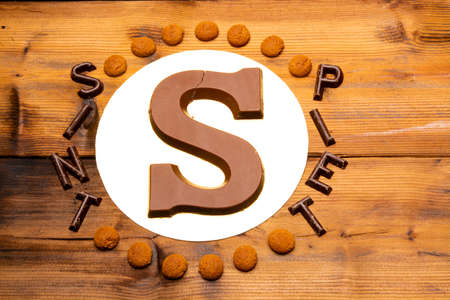 Celebration of Saint Nicholas, patron saint of children in Netherlands, Belgium, Luxembourg and North of France in first week of December, chocolate letters S and names of Sint and Piet close upの写真素材