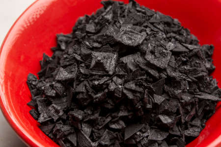 Black sea salt close up, add drama and style to your meals by sprinkling on some Cyprus Black Salt shiny black pyramid-shaped crystals right at your tableの写真素材