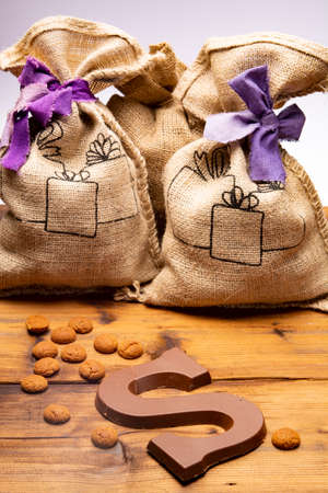 Celebration of Saint Nicholas, patron saint of children in Netherlands, Belgium, Luxembourg and North of France in first week of December, burlap sacks with presents and candy for kids  close upの写真素材