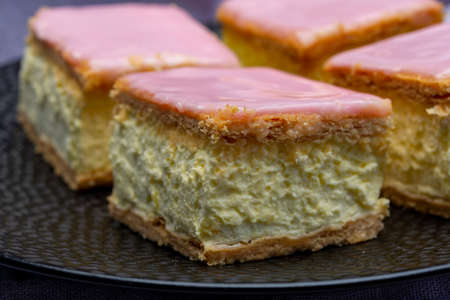 Tompoes or tompouce, iconic pastry in Netherlands and Belgium made from puff dough, icing, cream...