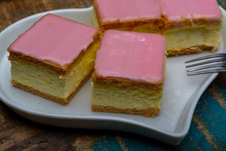 Tompoes or tompouce, iconic pastry in Netherlands and Belgium made from puff dough, icing, cream...
