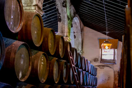 Production of fortified jerez, xeres, sherry wines in old dark oak barrels in sherry triangle, Jerez la Frontera, El Puerto Santa Maria and Sanlucar Barrameda Andalusia, Spainの写真素材