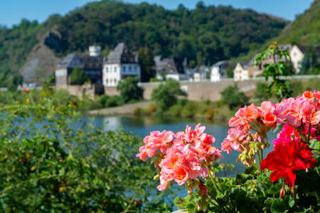Street in old German town with traditional medieval timber framing houses, Mosel river valley,...