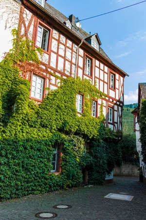 Street in old German town with traditional medieval timber framing houses, Mosel river valley, Germanyの写真素材