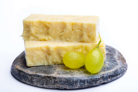 Cheddar cheese collection, block of Cheddar cheese made from cow milk close upの写真素材