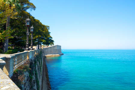 Seafront promenade in one of oldest city in Europe, Cadiz, Andalusia, Spain in summerの写真素材