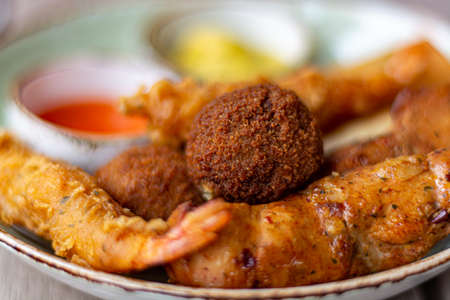 Dutch snacks for beer or wine, tempura shrimps, skewered chicken, bitterballs and hot dip sauces...