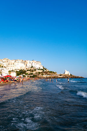 August 12, 2019, Sperlonga, Italy, View on old town Sperlonga and clowded sandy beach during August holidays in Lazio, Italyのeditorial素材
