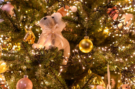 Christmas tree decorated is festivily decorated with vintage colorful balls, garlands and toys close up, Christmas backgroundの写真素材