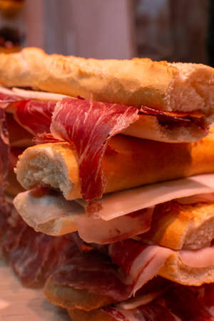 Spanish tapas street food, bocadillo fresh bread with jamon iberico ready to eatの写真素材