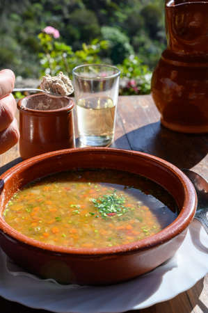 Homemade vegetables soup served on outdoor terrace with Canarian gofio flour based on local recipe of Masca village, Tenerife, Spainの写真素材