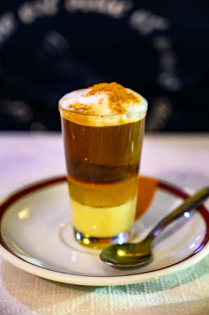 Special coffee of Canarian islands in Spain, sweet barraquito coffee with layers and alcohol served in glassの写真素材