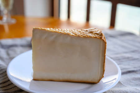 Cheese collection, piece of smoked Spanish goat cheese close upの写真素材