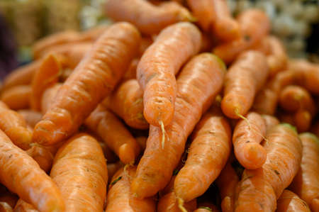 Fresh sweet organic carrots roots for sale on Sunday farmers market on Tenerife, Canary islands,...