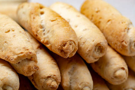 Small italian bread rolls crostini made from wheat dough with sesame close up