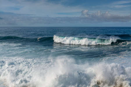 Dangerous ocean stormy waves hits black lava rocks by Faro de las Hoyas, La Palma island, Canary, Spainの写真素材