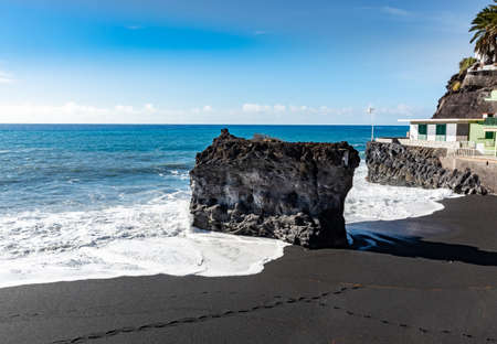 Black lava sand beach in Puerto Naos, La Palma, Canarian islands, Spain in winterの写真素材