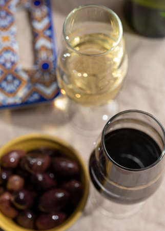 Close up tasty  fortified wine from Andalusia, Spain, different types of sherry in glasses and olives, colors of Andalusisaの写真素材