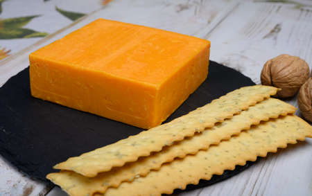 Leicestershire cheese or red leicester, British hard cheese made from cow milk close up
