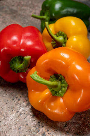 Fresh red, orange, green and yellow sweet bell paprika close upの写真素材