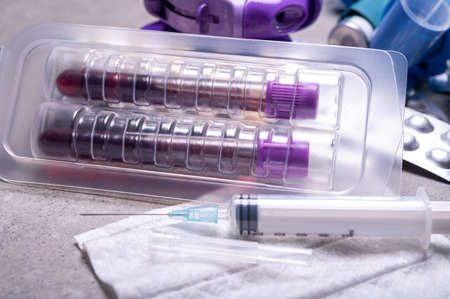Medical test-tubes with blood samples for screening of virus, flu or bacterial infections and...
