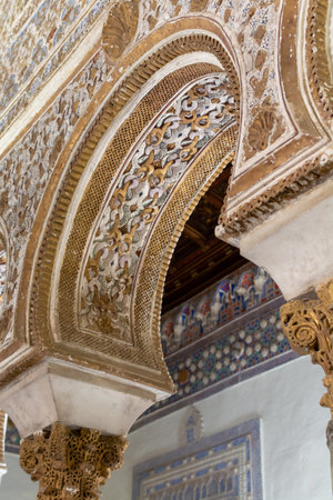 September 9, 2019, Sevilla, Andalusia, Spain, interior of beautiful moorish palace Alcazar with carved walls and ceilings, up viewのeditorial素材