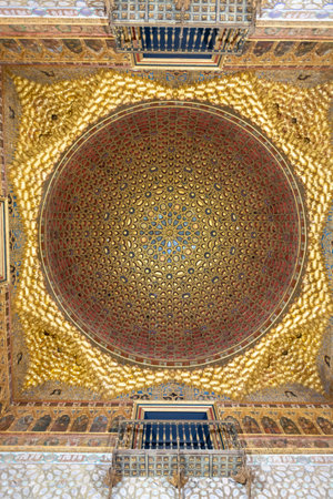 September 9, 2019, Sevilla, Andalusia, Spain, interior of beautiful moorish palace Alcazar with carved walls and ceilings, up viewのeditorial素材