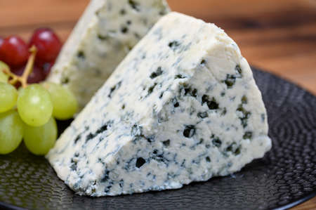 Cheese collection, strong Danish blue cheese Danablu with blue mould close up