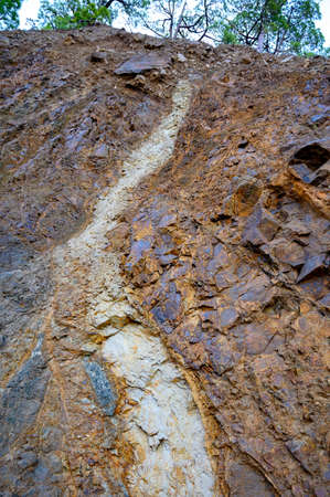 Geological formation with lava colums after magma eruption from stratovolcano close up