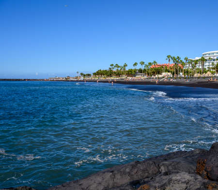 All year sun travel destination in Europe, blue ocean water on beach Playa del Duque in Costa Adeje,...