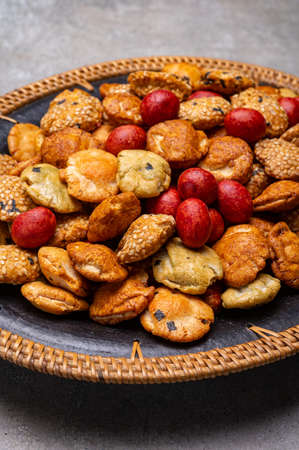 Tasty asian vegetarian appetizer, crunchy rice en peanuts snacks from Japan in bowl