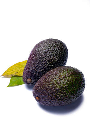 Healthy food, fresh ripe hass avocado fruit from Peru isolated on white background