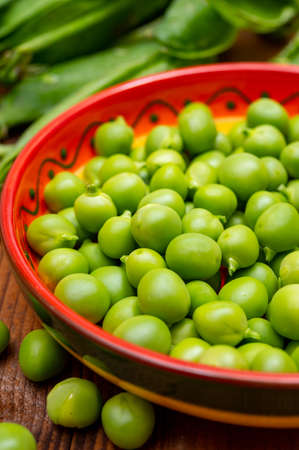 New harvest of fresh ripe green peas legumesの写真素材